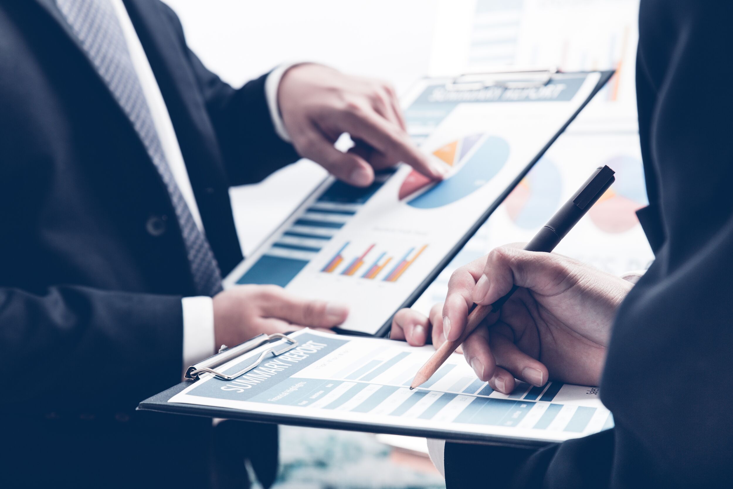 Coworkers working through a checklist.